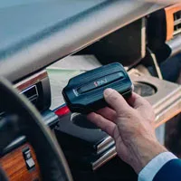 POWER FINDER 4G GPS Tracker placed in the dashboard of a car