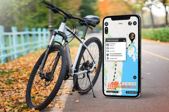A bicycle on road and also a mobile phone with tracking