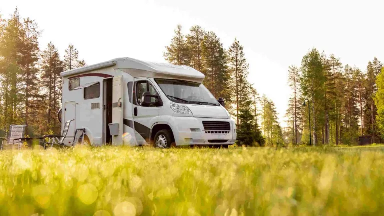 A white trailer parked in countryside protected with PAJ Vehicle GPS tracker