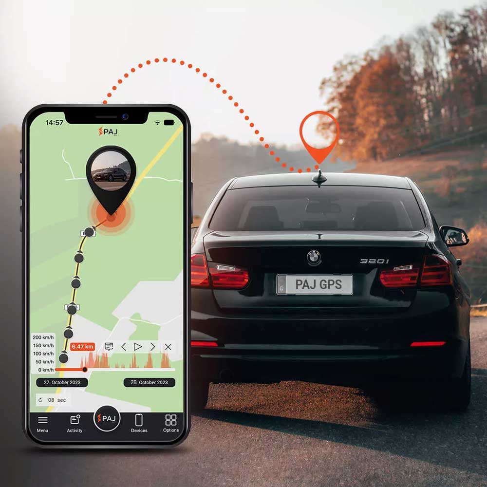 A black car on road and on its side a mobile running paj finder portal application with live tracking