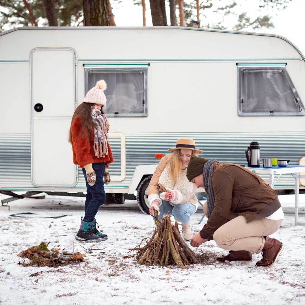 Family enjoying their vacation in a caravan with POWER Finder 4G installed in it