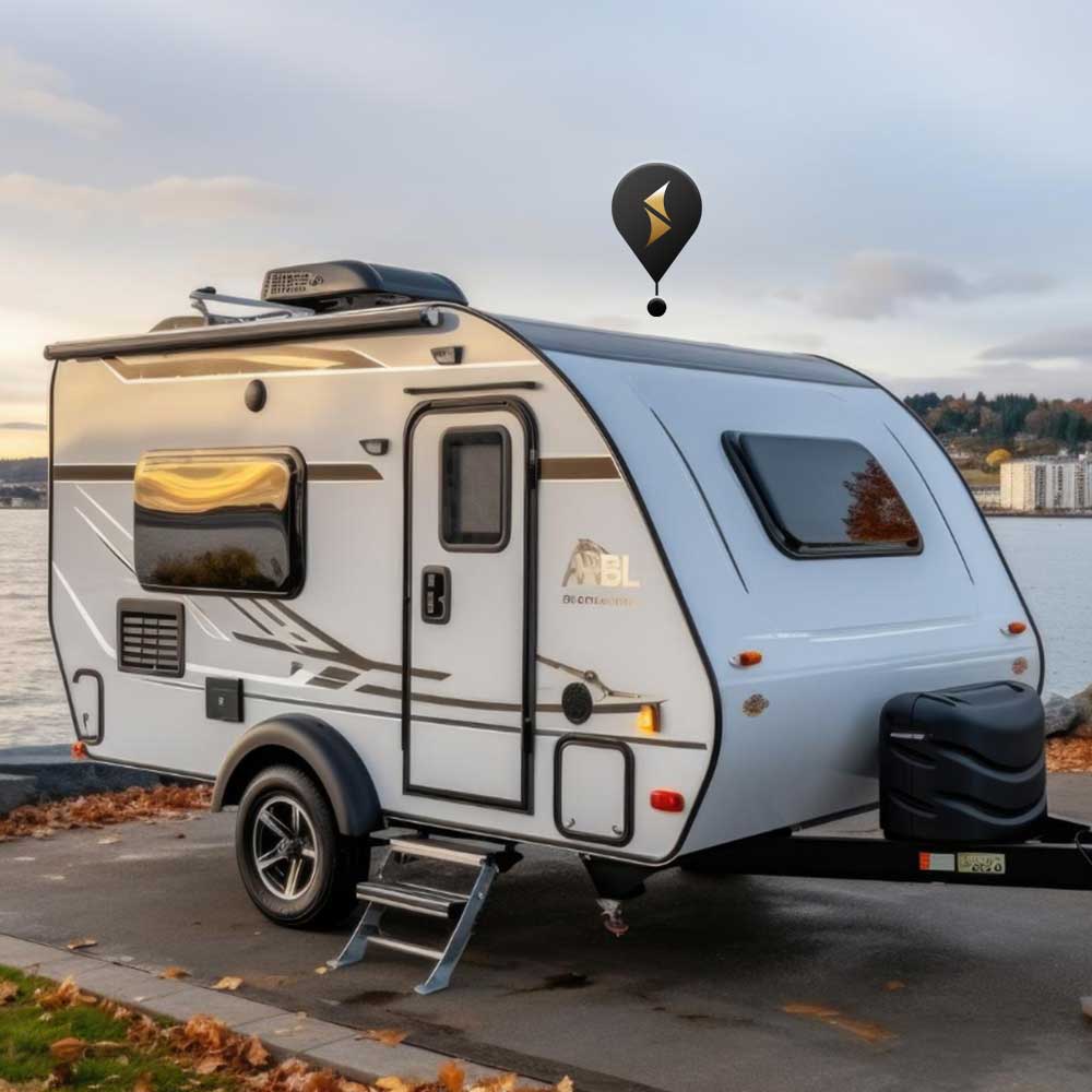 a caravan parked near river side having PAJ GPS's caravan tracker installed in it