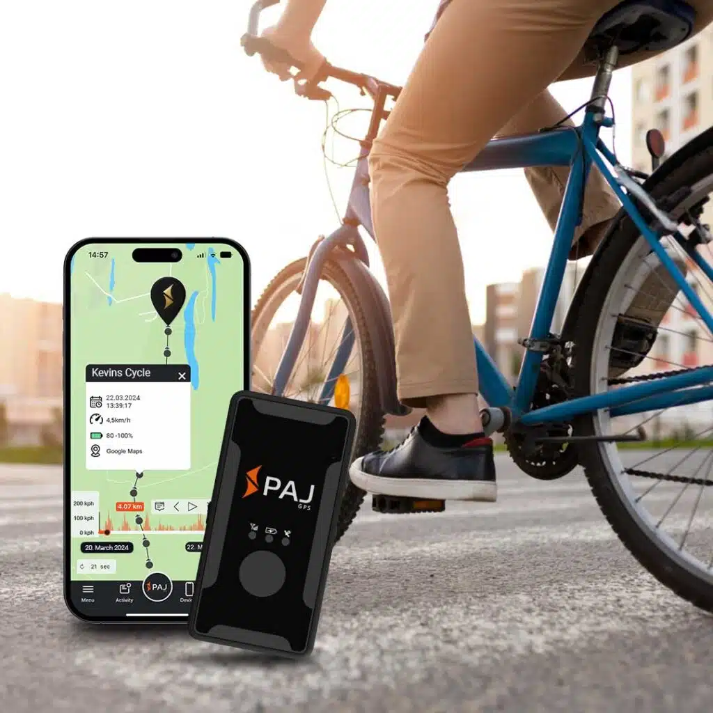 easy finder 4g bike tracker device on right side and a phone having app opened in it to show live tracking