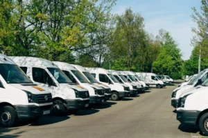 vans parked in the parking lot with gps fleet tracking installed in it