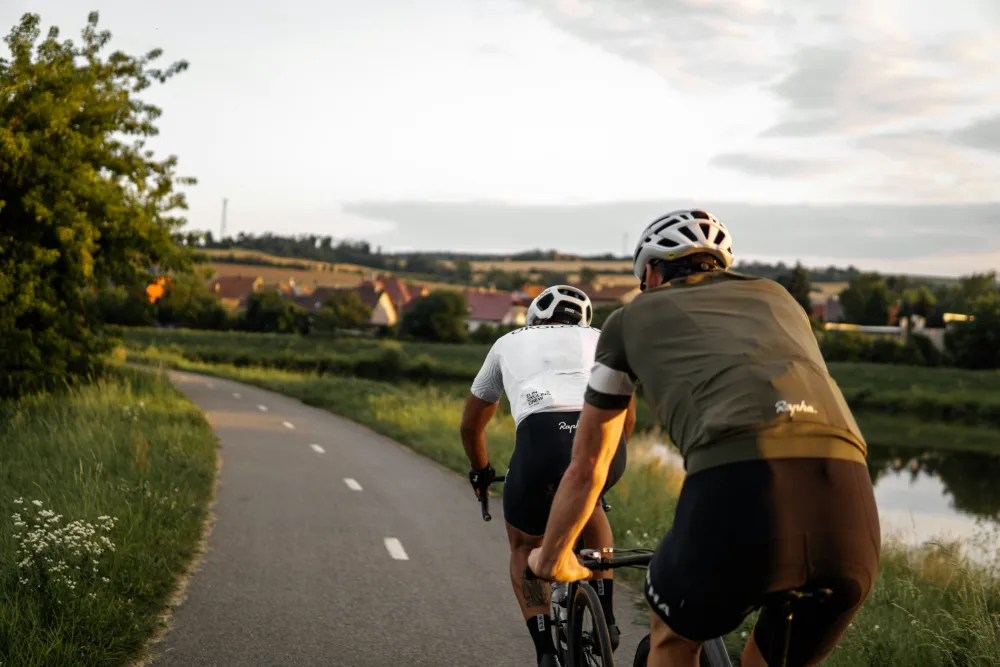 two persons on their bike travelling on a road